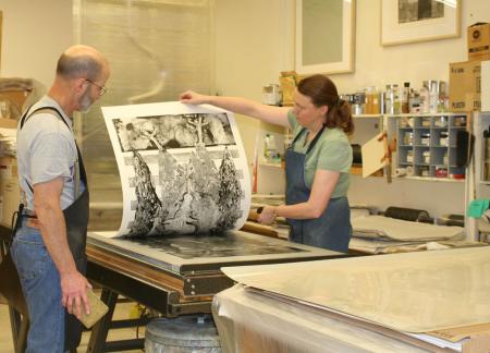 image: Richard Finch and Veda Rives pulling an impression during the printing of Geryon by Rudy Pozzatti.