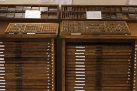 image: Type cabinets with cases in the SAIC shop.